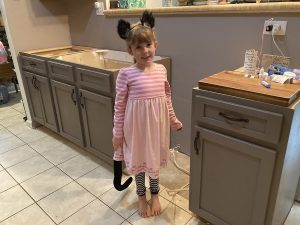 girl in the middle of a kitchen remodel