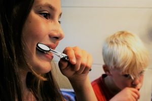 woman brushing her teeth
