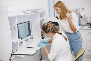 doctor helping patient with oral microbiome test