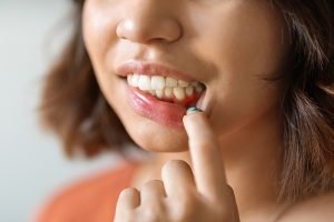 woman with gum pain