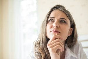 woman wondering how easy it is to do a mouth microbiome test
