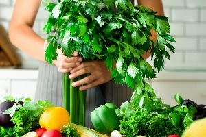 woman holding celery