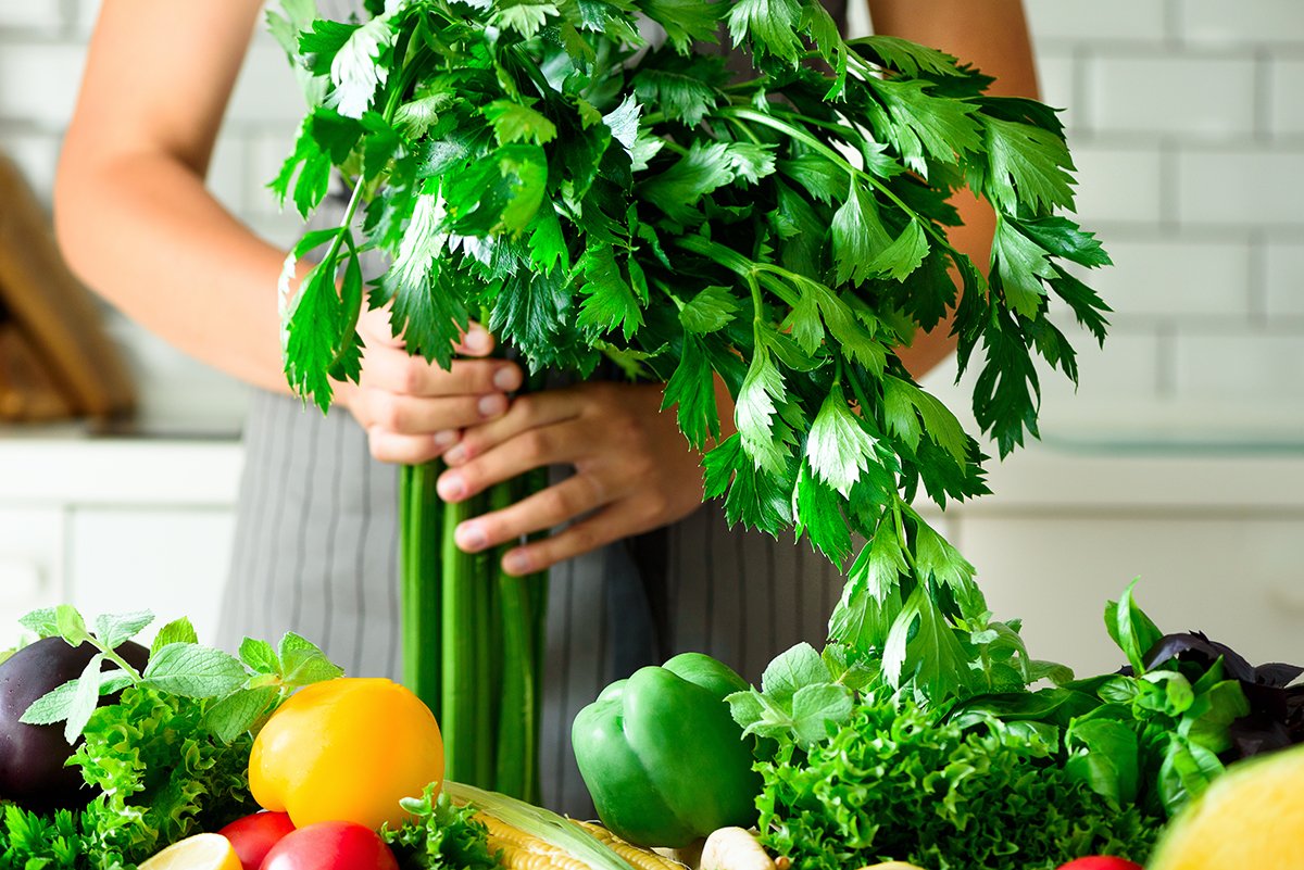 woman holding celery