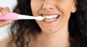 woman brushing her teeth