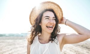 smiling woman with healthy oral microbiome