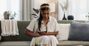 woman with burning gut pain