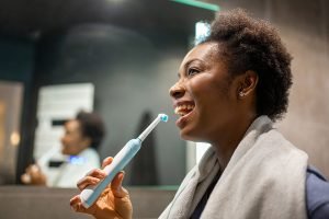 woman brushing her teeth