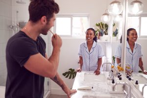 man brushing his teeth