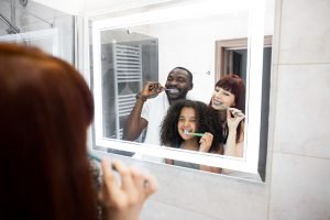 family brushing their teeth together