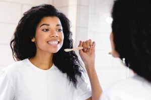 woman brushing her teeth