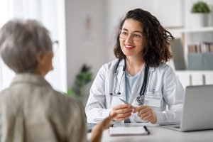 doctor and patient discussing Colon Cancer Testing Options