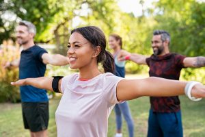 healthy people exercising outdoors