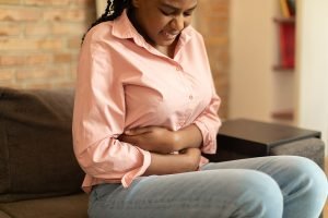 woman with painful gut symptoms